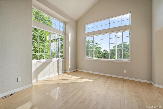 9602 Indian Wells Dr, Lone Tree, CO 80124 - empty room featuring hardwood / wood-style flooring, lofted ceiling, and baseboards