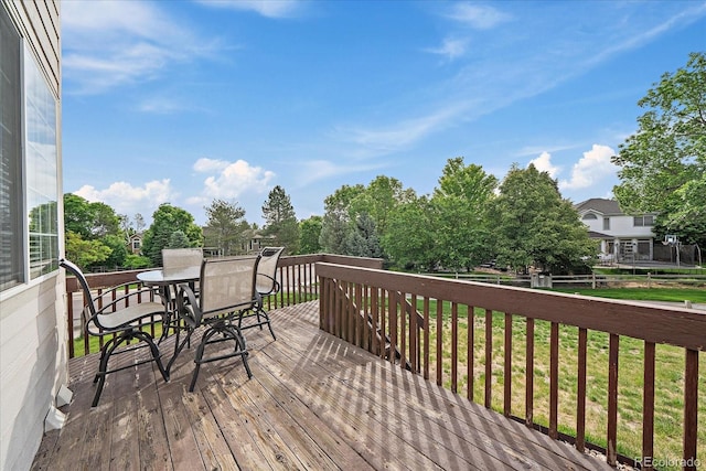 9602 Indian Wells Dr, Lone Tree, CO 80124 - wooden deck featuring outdoor dining space and a yard
