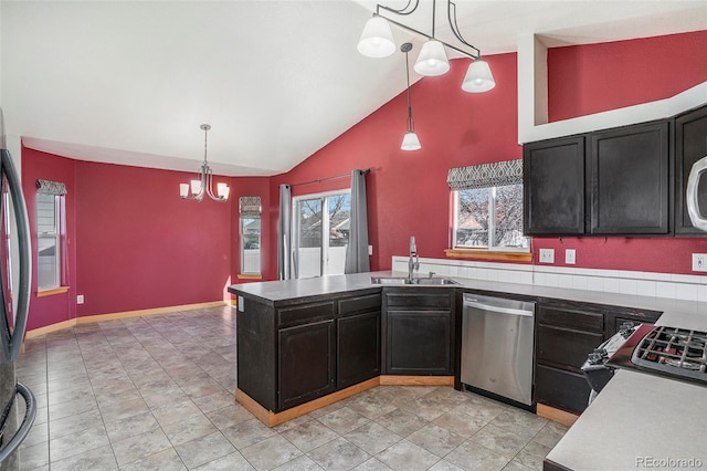 kitchen with an inviting chandelier, decorative light fixtures, stainless steel dishwasher, and sink