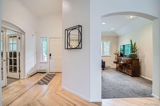 1851 S Marshall Cir, Lakewood, CO 80232 - entryway with arched walkways, healthy amount of natural light, light wood-style floors, and recessed lighting