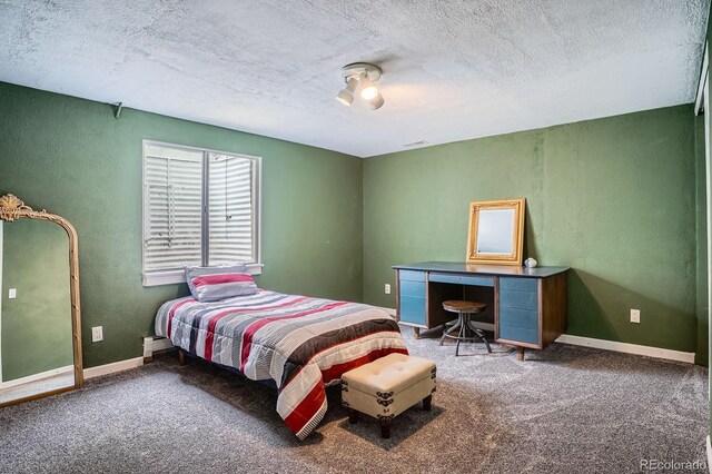1851 S Marshall Cir, Lakewood, CO 80232 - bedroom with a textured wall, a textured ceiling, carpet floors, and baseboards