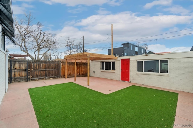 view of yard featuring a patio area and a fenced backyard