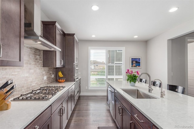 15843 E Broncos Pl, Englewood, CO 80112 - kitchen with a sink, wall chimney exhaust hood, appliances with stainless steel finishes, baseboards, and recessed lighting
