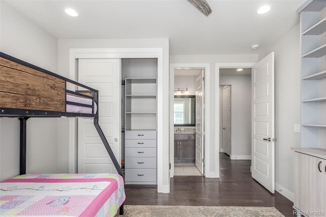15843 E Broncos Pl, Englewood, CO 80112 - bedroom featuring dark wood finished floors, baseboards, recessed lighting, a closet, and ensuite bath