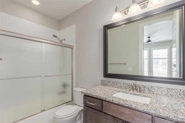15843 E Broncos Pl, Englewood, CO 80112 - full bath with ceiling fan, toilet, enclosed tub / shower combo, and vanity