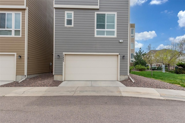 15843 E Broncos Pl, Englewood, CO 80112 - view of front facade with an attached garage and concrete driveway