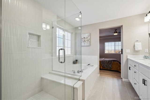 bathroom featuring tile patterned floors, plus walk in shower, and vanity