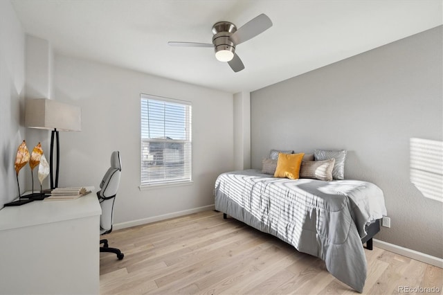 bedroom with ceiling fan and light hardwood / wood-style floors