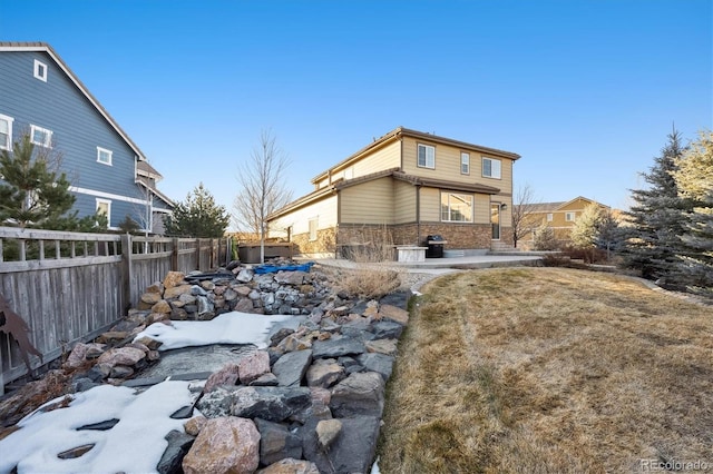 back of house with a patio