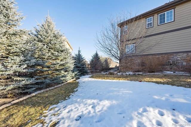 view of yard covered in snow