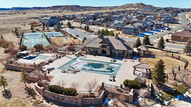 birds eye view of property featuring a mountain view