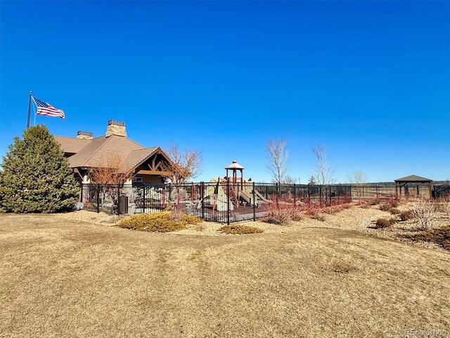 view of jungle gym featuring a lawn