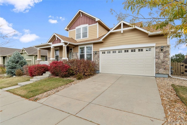 6470 S Ider St, Aurora, CO 80016 - craftsman inspired home with board and batten siding, concrete driveway, stone siding, a garage, and a front yard