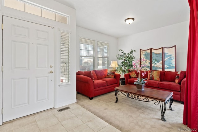 6470 S Ider St, Aurora, CO 80016 - carpeted living room with tile patterned floors and baseboards