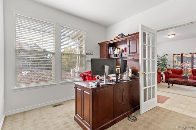 carpeted office space with french doors