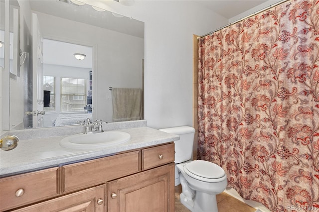 6470 S Ider St, Aurora, CO 80016 - full bathroom featuring toilet, vanity, a shower with shower curtain, and tile patterned flooring