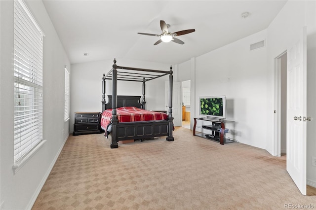 carpeted bedroom featuring ceiling fan and vaulted ceiling