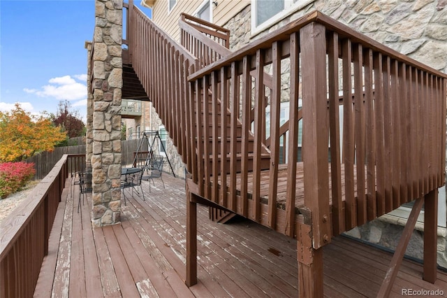 6470 S Ider St, Aurora, CO 80016 - wooden deck with stairway and outdoor dining area