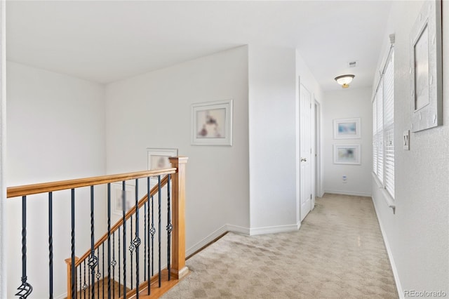 hallway with light carpet