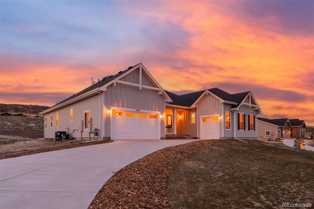5693 Missoula Trl, Castle Rock, CO 80108 - view of front of house with board and batten siding, an attached garage, and concrete driveway
