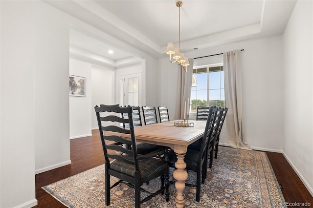5693 Missoula Trl, Castle Rock, CO 80108 - dining room with a tray ceiling, dark wood-style flooring, recessed lighting, and a chandelier