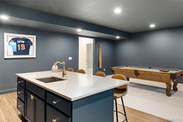 5693 Missoula Trl, Castle Rock, CO 80108 - kitchen featuring light wood finished floors, a breakfast bar, recessed lighting, light countertops, and billiards table