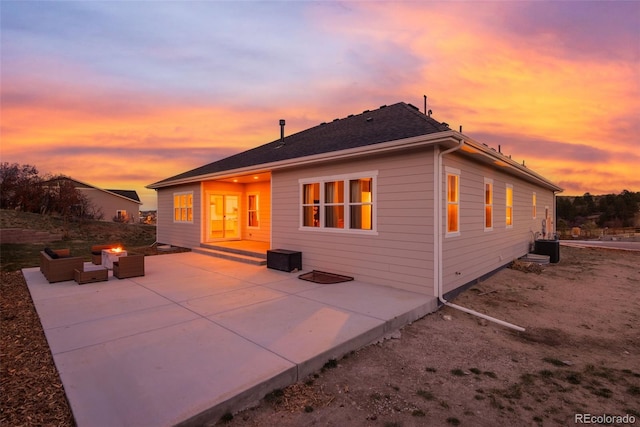 5693 Missoula Trl, Castle Rock, CO 80108 - back of property at dusk featuring a patio and an outdoor hangout area