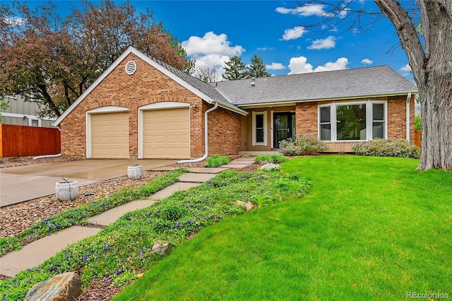 ranch-style house with a garage, driveway, brick siding, and roof with shingles