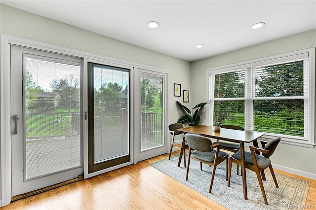 dining area with light wood-style flooring, recessed lighting, and baseboards