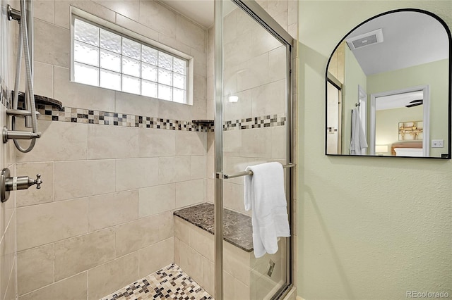bathroom featuring a shower stall
