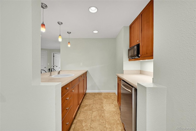 kitchen featuring stainless steel dishwasher, a sink, light countertops, hanging light fixtures, and black microwave