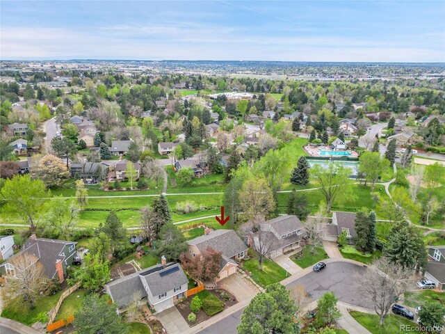 view of property location featuring nearby suburban area and a pool