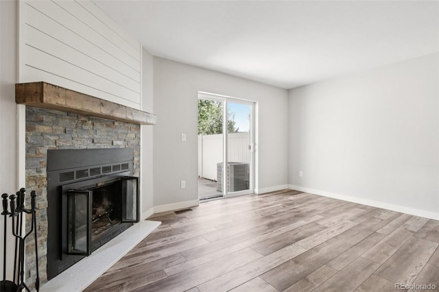 1707 Ostia Cir Unit 46, Lafayette, CO 80026 - unfurnished living room with wood finished floors and a fireplace