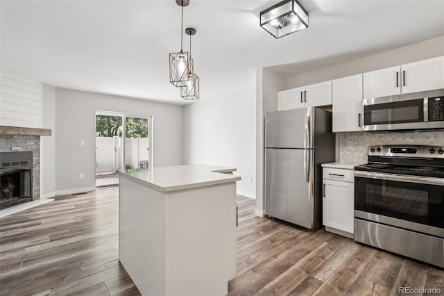 1707 Ostia Cir Unit 46, Lafayette, CO 80026 - kitchen with stainless steel appliances, white cabinetry, and light countertops