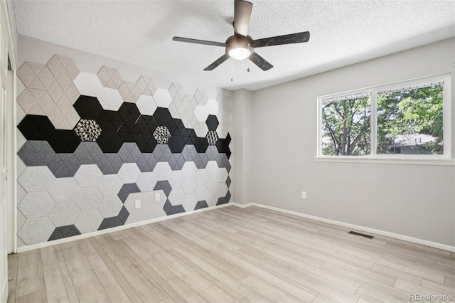 1707 Ostia Cir Unit 46, Lafayette, CO 80026 - unfurnished room featuring a textured ceiling, light wood-style flooring, and a ceiling fan
