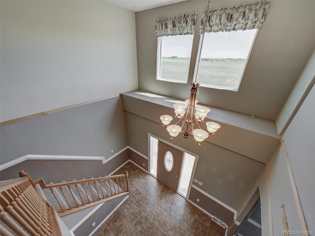 foyer featuring a chandelier