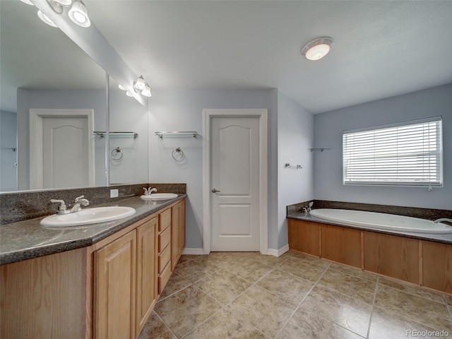 bathroom featuring vanity, a tub to relax in, and tile patterned flooring