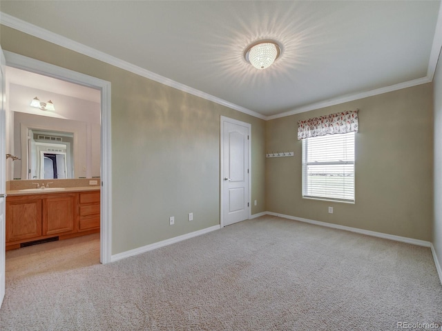 unfurnished bedroom with crown molding, sink, and light carpet