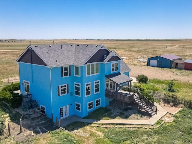 birds eye view of property featuring a rural view