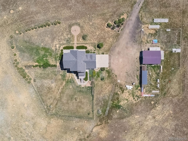 birds eye view of property featuring a rural view