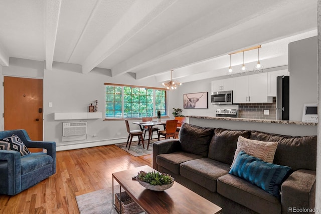 living room featuring a baseboard heating unit, an AC wall unit, beam ceiling, light wood-style flooring, and an inviting chandelier