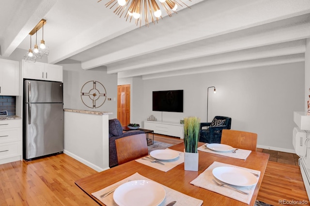 dining room with beam ceiling, light wood-type flooring, baseboards, and a chandelier