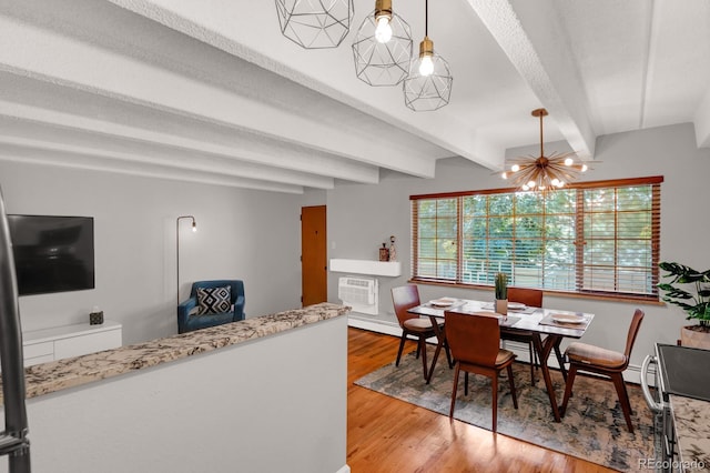 dining space with a wall mounted air conditioner, beamed ceiling, a textured ceiling, light wood finished floors, and baseboards