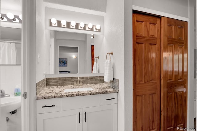 full bathroom with a sink and a textured wall