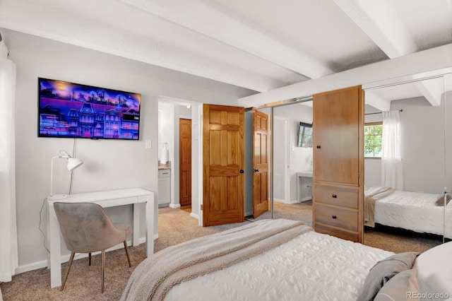 bedroom featuring beam ceiling, light colored carpet, and baseboards