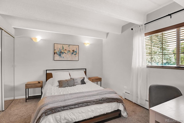 bedroom with beamed ceiling, a baseboard radiator, baseboards, and carpet floors