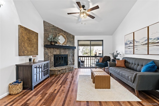 living room with high vaulted ceiling, a fireplace, wood finished floors, and ceiling fan