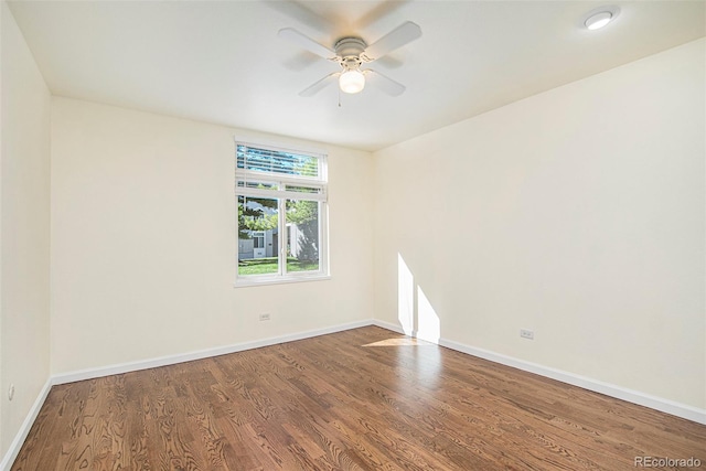 empty room featuring hardwood / wood-style floors and ceiling fan