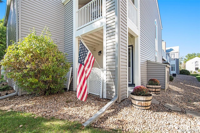 view of side of home with a balcony