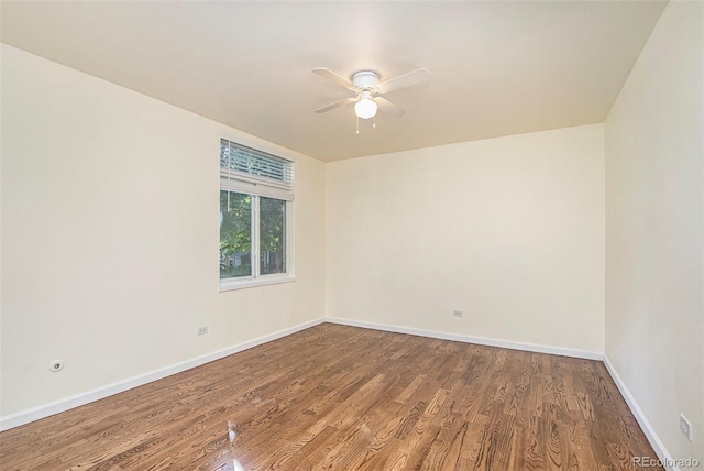 empty room with wood-type flooring and ceiling fan